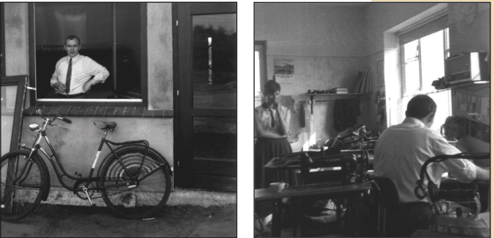 Das Bild ist in zwei Hälften aufgeteilt. Links zeigt es eine Person, die an einem Fenster eines Hauses steht, mit einem Fahrrad davor. Rechts befinden sich zwei Menschen, die an Tischen in einem Raum arbeiten, mit Büchern, Papieren und technischen Geräten auf den Tischen.
